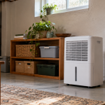 AI illustration of a generic white portable dehumidifier standing in a tidy basement living area.