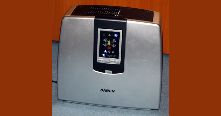 The silver and black exterior of a Baren B-757 air purifier with its front control panel and top grille visible